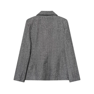 Detail view of the back of a slim fit grey herringbone tweed blazer with sharp tailoring