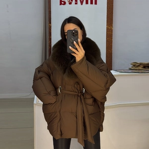 Deep brown winter coat featuring a luxurious large fur collar and adjustable waist belt