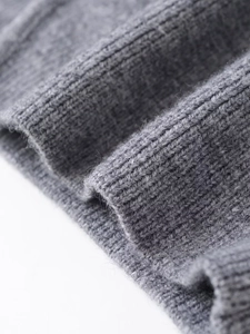 Detail of grey double-sided knit fabric showing soft texture and thick winter material