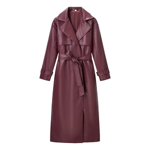 Detail of burgundy leather trench coat showing lapel collar and waist belt