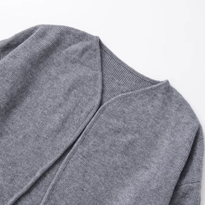 Women's grey double-sided knit cardigan featuring a V-neckline and soft ribbed texture