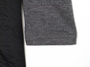 Détail des poignets en tricot extensible avec coutures à double aiguille et finition