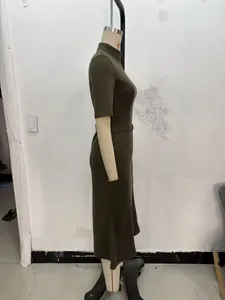 Detail view of olive green knit dress showing mock neck, half sleeves and matching waist belt