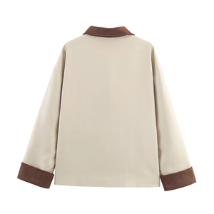 Detailed back view of a minimalist color-block windbreaker jacket with contrast brown collar