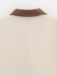 Detailed view of the contrast collar and textured fabric on this fashion jacket