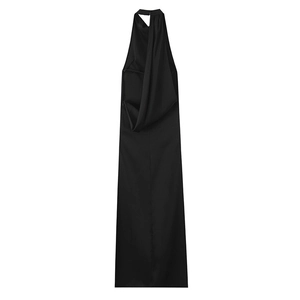 Detail of the high-quality black satin fabric and halter neckline of the long evening dress