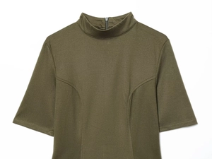 Detail view of military green short-sleeve dress featuring a stand collar and back zipper