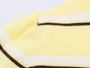 Detail shot of the shoulder seam on a striped polo knit sweater with fine stitching