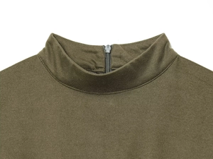 Detail shot of a stand-up collar with metallic zipper on an olive green knitted dress