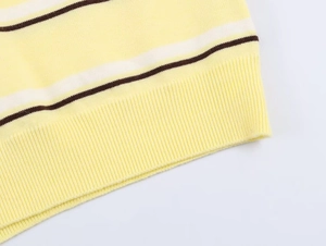 Detailed view of the striped knit sweater featuring ribbed hem and fine texture