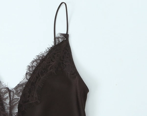 Detailed view of dark chocolate satin slip dress with exquisite floral eyelash lace trim