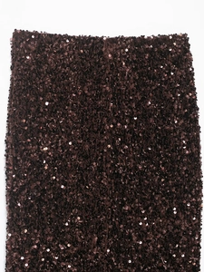 Detailed view of dense dark brown sequins on a sequined mermaid skirt with rich texture