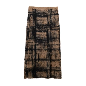 Detailed view of the fuzzy plaid knit texture on this warm brown and black maxi skirt