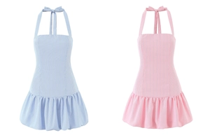 Detail of light blue and pink halter neck mini dresses with vertical stripe texture
