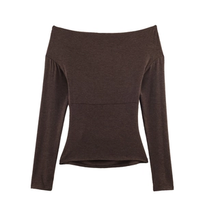 Detailed view of dark brown off-shoulder top showing slim fit knit texture and seams