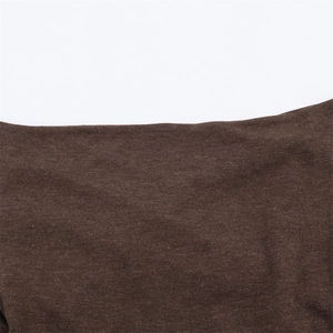 Close-up of deep brown knitted fabric showing fine texture and seamless stitching detail