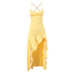 Detail of light yellow satin dress featuring cross back straps and ruffled asymmetric hemline