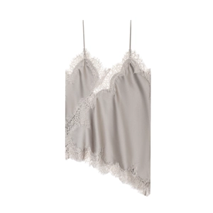 Detail of champagne satin camisole featuring delicate eyelash lace trim and asymmetric hem