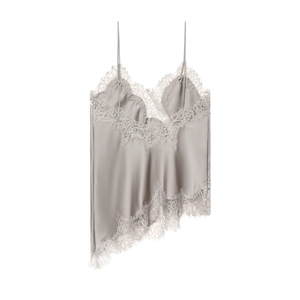 Detailed view of silver satin camisole featuring intricate cream lace trim and asymmetric hem