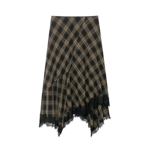 Detailed view of asymmetric plaid skirt hem with delicate black eyelash lace trim