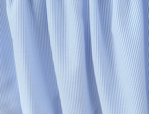 Detailed close-up of premium blue and white vertical pinstripe cotton blend fabric