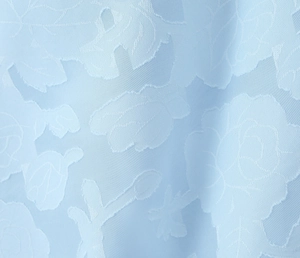 Close-up of light blue mesh fabric with elegant jacquard rose floral patterns and textures