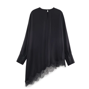 Close-up of black satin long sleeve top with intricate lace hem and buttoned cuffs