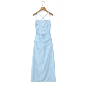 Detailed view of light blue backless dress featuring intricate floral jacquard texture