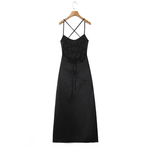 Detail of the cross-back lace-up design and silky fabric on this black backless maxi dress