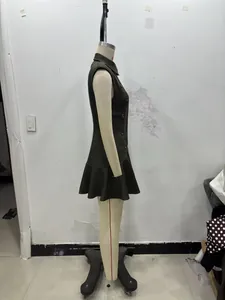 Side view of olive green sleeveless blazer dress with double-breasted buttons and ruffled hem