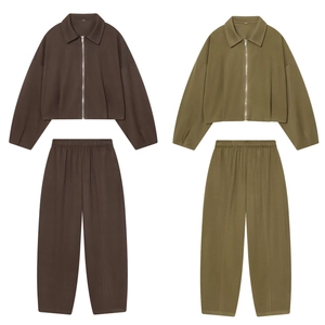 Detailed flat lay of zip-up jackets and matching trousers in brown and olive green sets