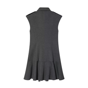 Detail view of the back of a sleeveless dark grey dress featuring epaulets and a ruffled hem