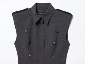Detail of dark grey sleeveless blazer vest with lapel collar and marble pattern buttons