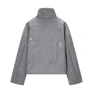 Close-up of silver sequin snowflake embroidery on gray stand collar short jacket back