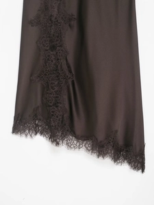 Close-up of elegant dark brown satin dress featuring delicate eyelash lace trim detail