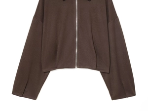 Detail of dark brown zip-up jacket featuring a polished silver metal zipper and knit fabric