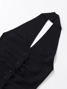 Close-up of black halter neck knit sweater with detailed buttons and ribbed texture