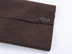Detail of dark brown corduroy sleeve cuffs with three buttons on the winter suit jacket