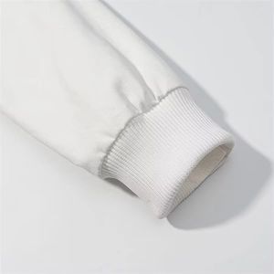 Detailed close-up of ribbed cuffs on a white long-sleeved winter hooded cotton coat