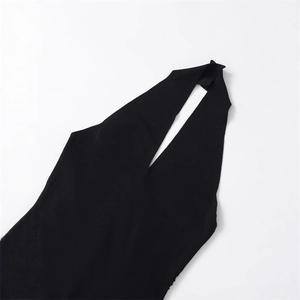 Women's black halter neck knit sweater with deep V-neckline in a loose minimalist style