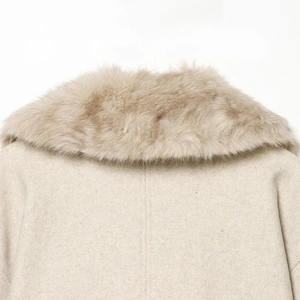 Elegant beige winter coat featuring a fluffy faux fur collar and textured wool finish