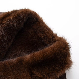 Close-up of deep brown faux fur texture showing fine dense fibers on a winter jacket