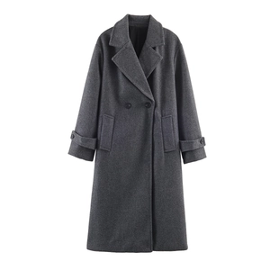 Detail of grey long wool coat showing lapels, double-breasted buttons and fabric texture