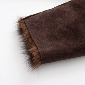 Detail view of winter jacket featuring brown faux suede fabric and plush faux fur trim