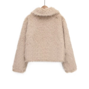 Rear view of luxury light beige faux fur jacket with fluffy long hair texture on a hanger