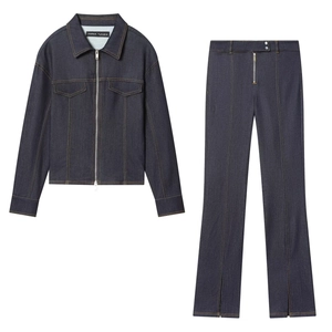Flat lay of slim fit dark blue denim set with zip jacket and split hem flared trousers