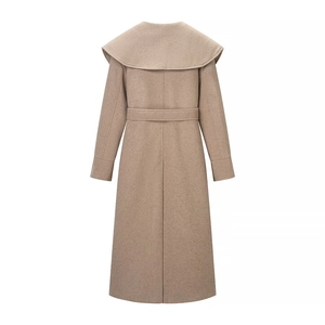 Rear view of a long wool coat featuring a wide shawl collar and matching waist belt