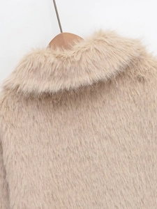 Detailed view of plush beige faux fur jacket collar on a wooden hanger for winter fashion