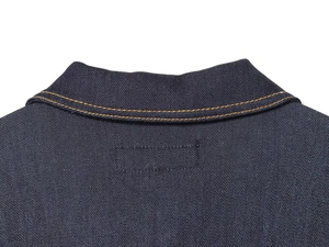 Detail of dark blue denim jacket collar with contrast orange double-stitch seams