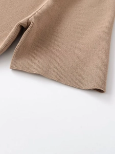 Detailed macro view of the khaki ribbed knit fabric and seamless stitching quality